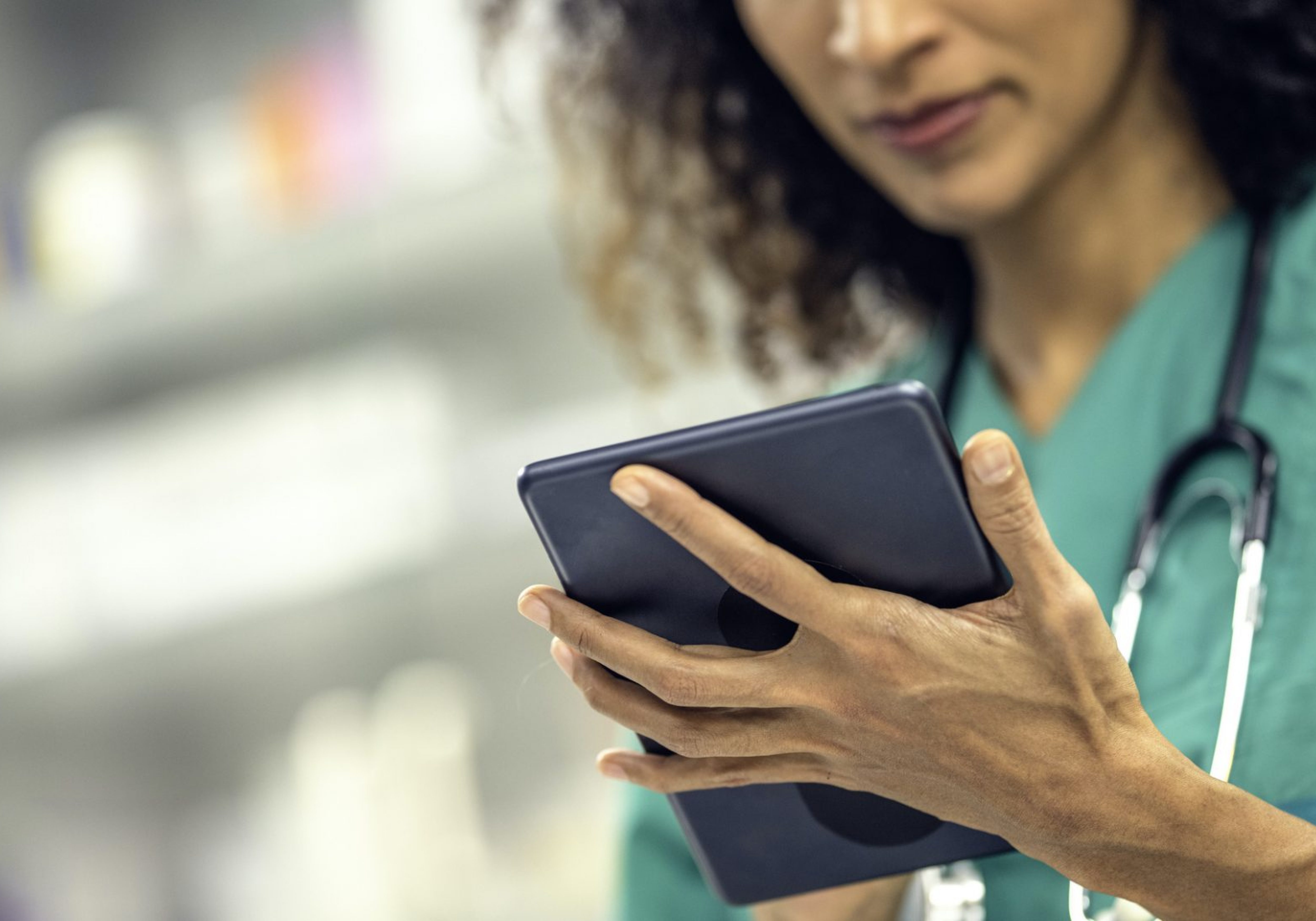 A vet focusing on a tablet.